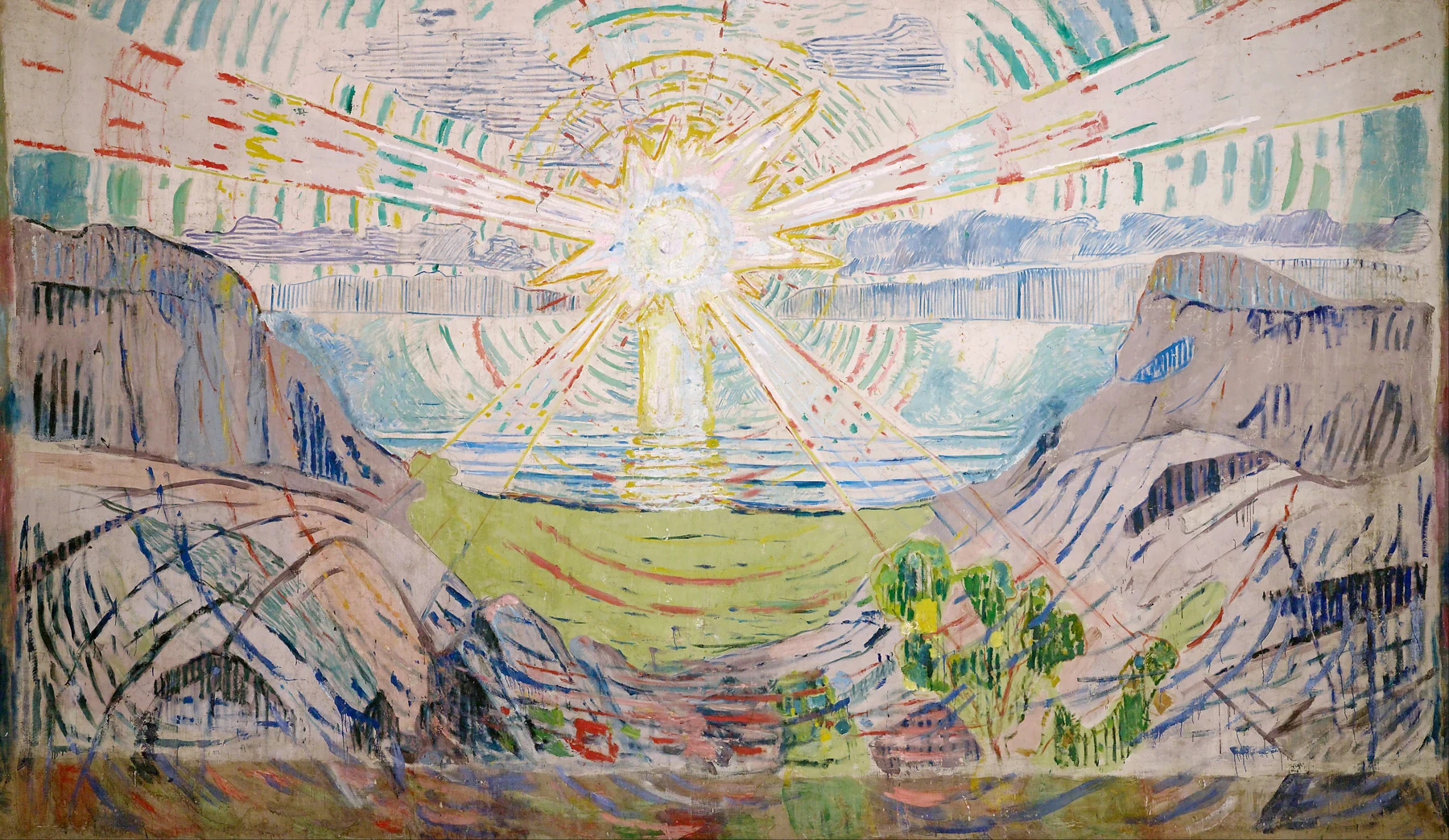 Rays of a bright sun spreading across a fjord, cliffs and sky.